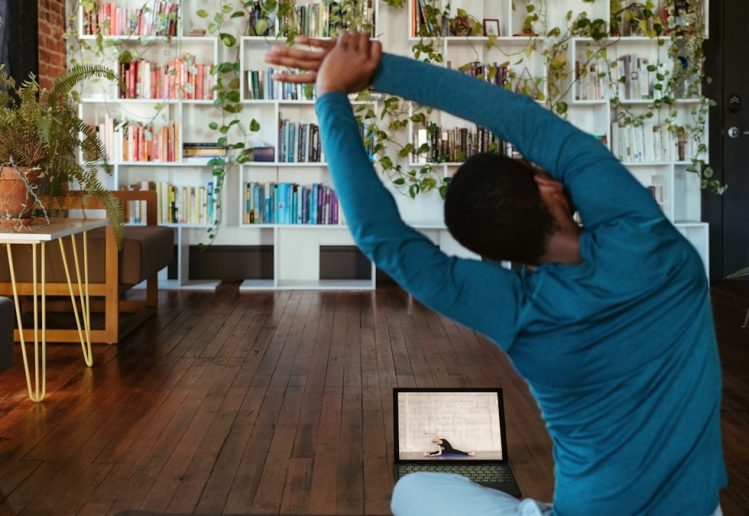 a man doing yoga in a living room