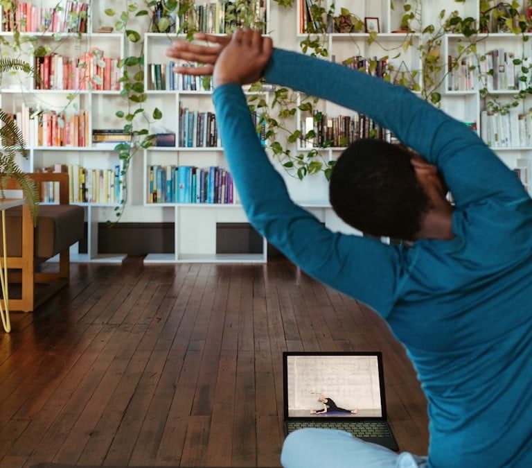 a man doing yoga in a living room
