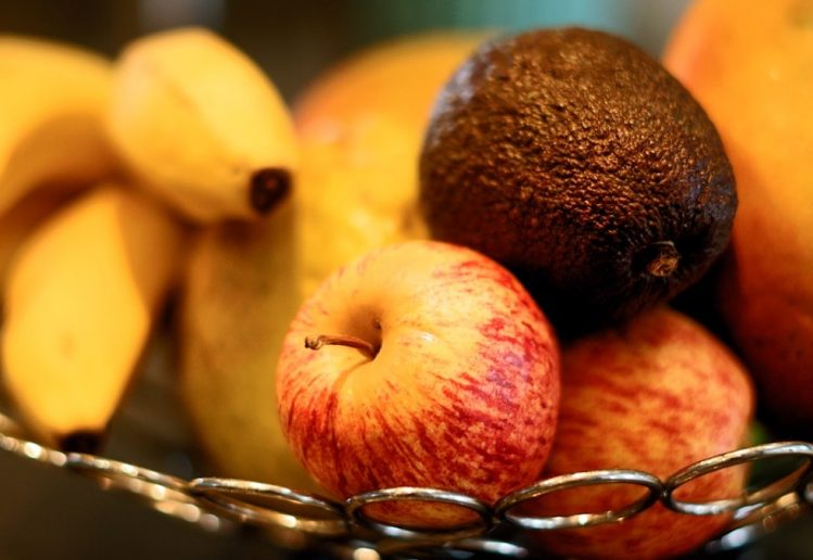 red apple fruit beside yellow banana fruit