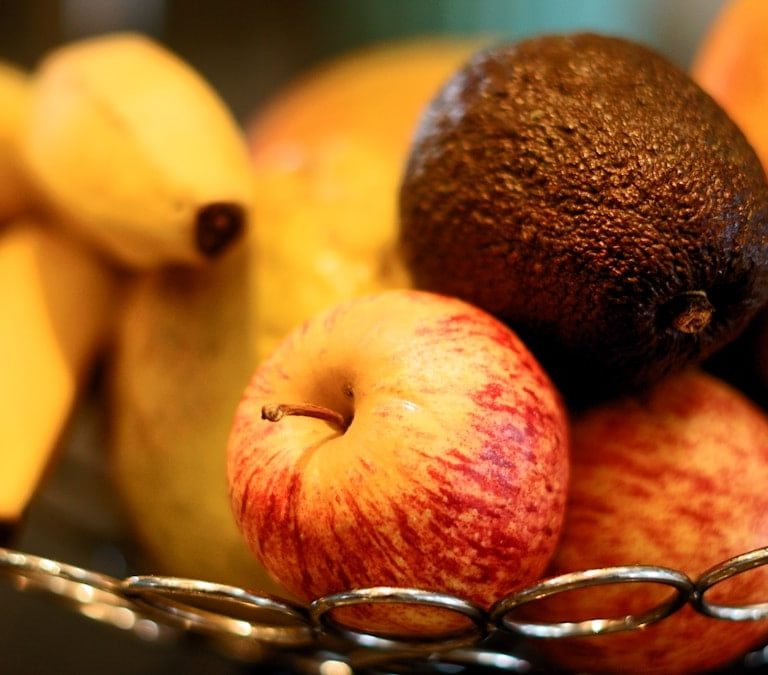 red apple fruit beside yellow banana fruit