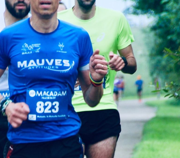 a group of men running down a road